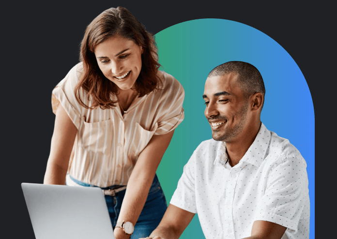 A woman and a man working on a laptop together.